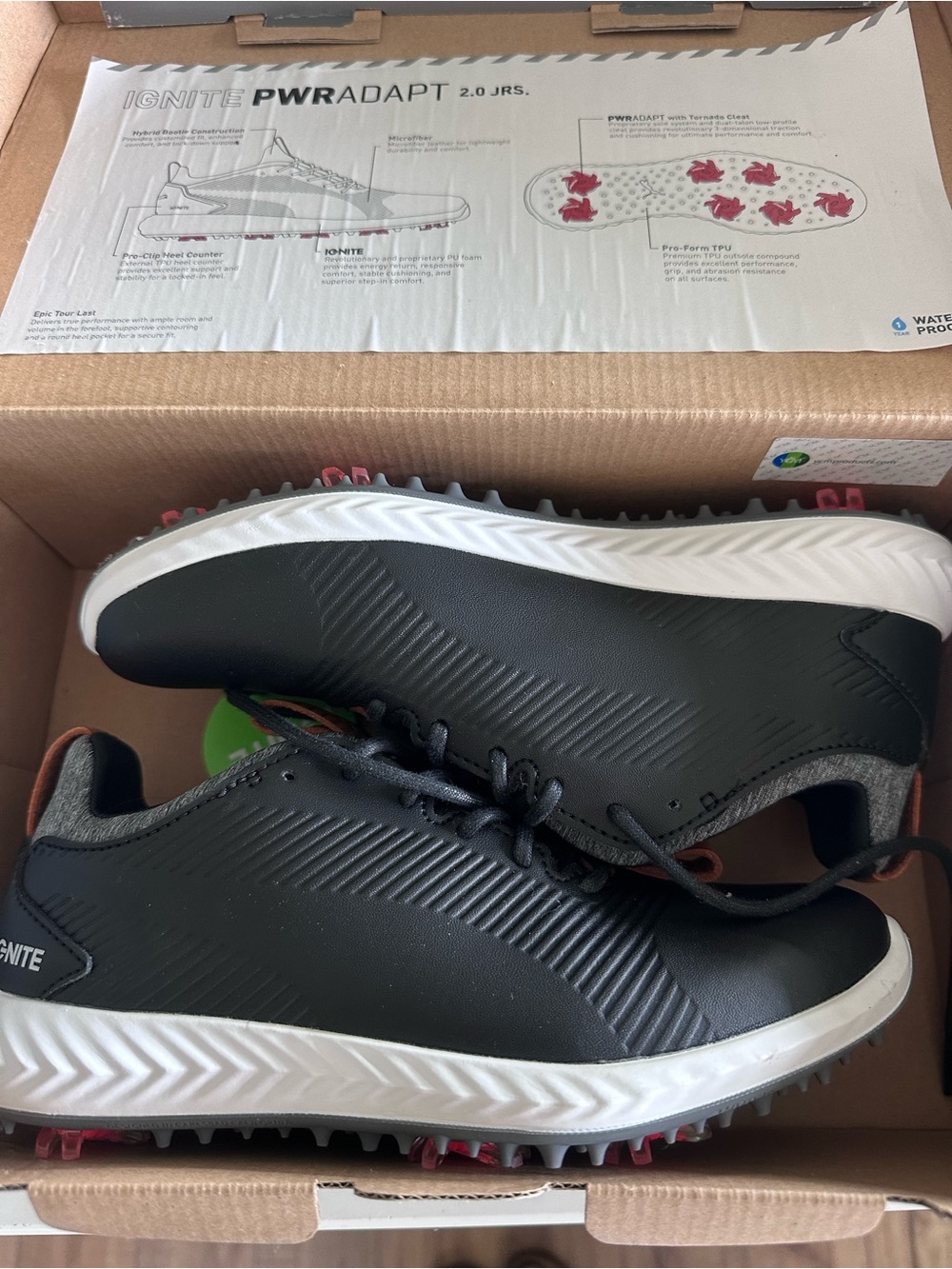 Puma boys Black and White Athletic Golf Shoes with Pink Spikes